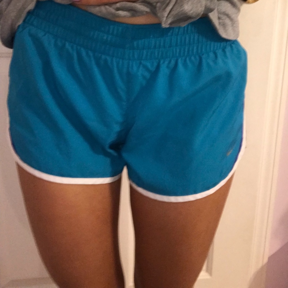 Blue Nike running shorts